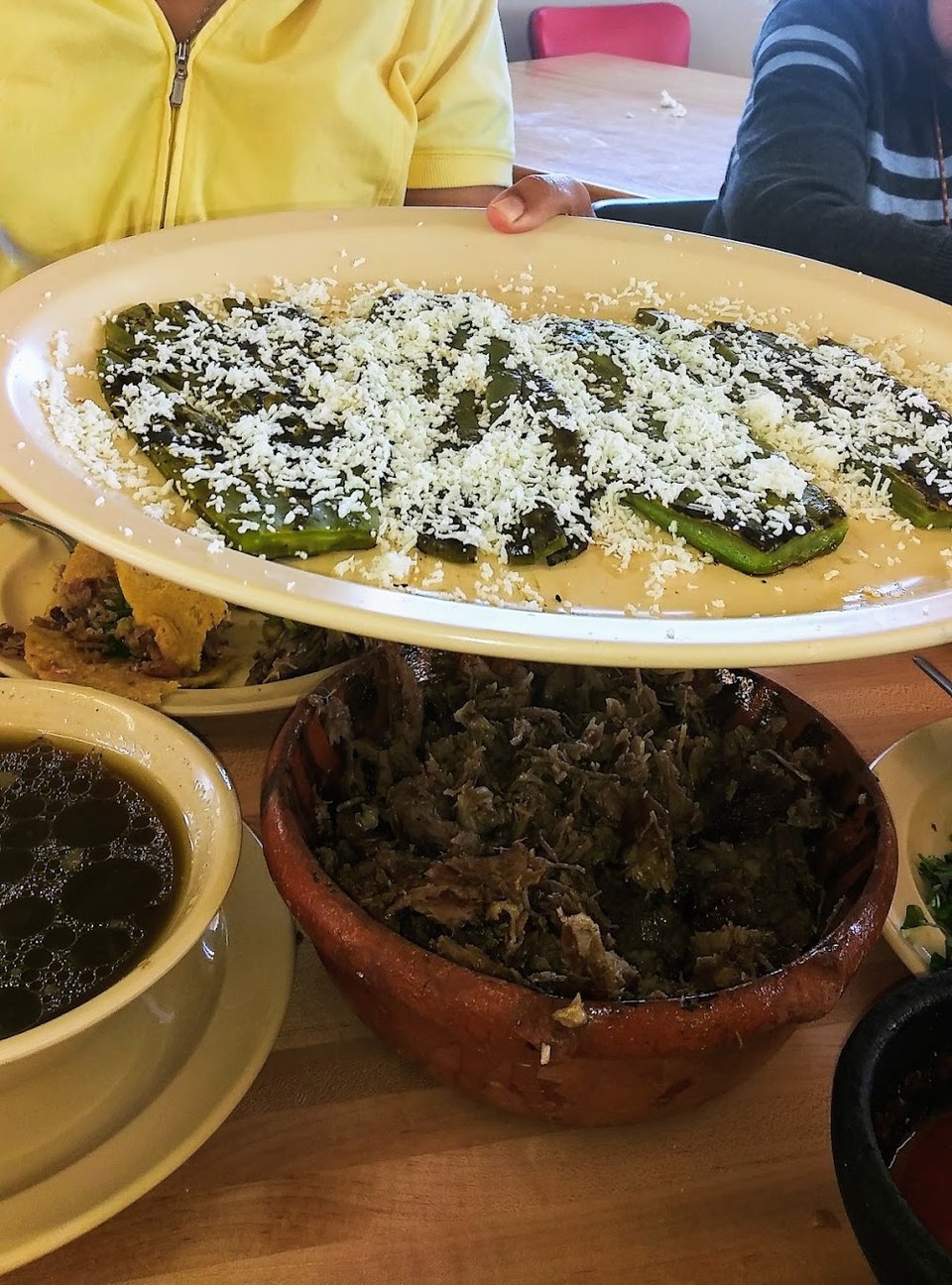 Breakfast menu page with chilaquiles and huevos.